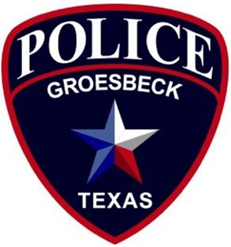 A blue and red police badge

Description automatically generated